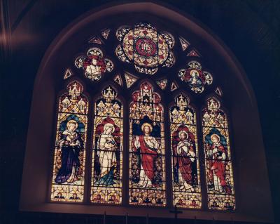 Stained glass windows in Dahlgren Chapel, showing Jesus and several saints