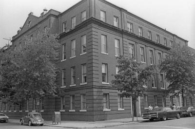 Black and white image of Coleman Nevils Building in 1983 showing the front left corner of the four story brick building.