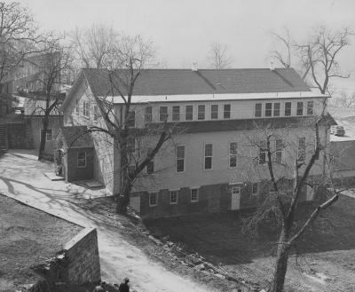 Black and white image of O'Gara Hall in 1946 showing a side view of the building's three stories.