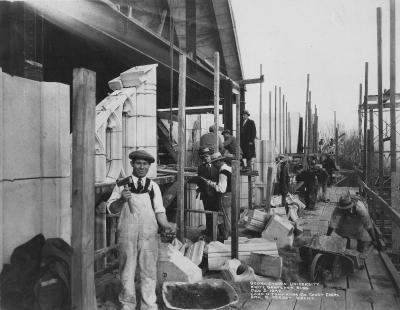 Black and white image of stone masons at work on White-Gravenor Hall in December 1932.