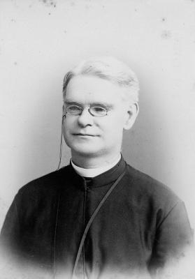 Black and white headshot of Fr. James A. Doonan in 1890 showing him dressed in clerical robes.