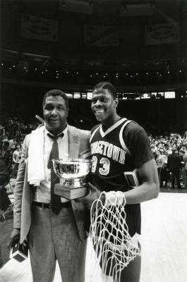 Image of Coach Thompson and Patrick Ewing holding a trophy