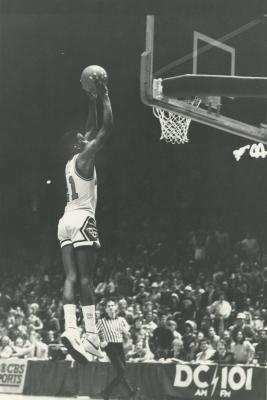 Floyd jumps next to the basket and attempts to score