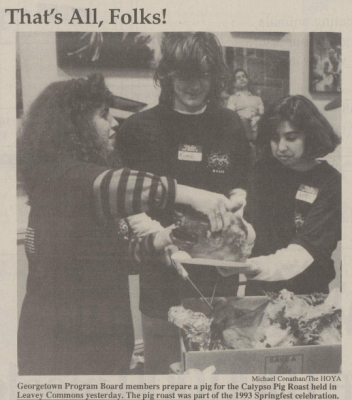 Georgetown Program Board members preparing a pig roast 