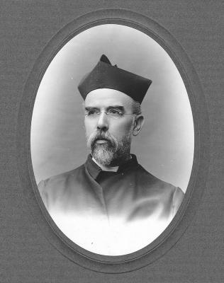 Black and white headshot of Fr. Joseph J. Himmel wearing clerical robes and biretta.