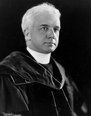 Black and white headshot of Fr. W. Coleman Nevils wearing academic regalia.