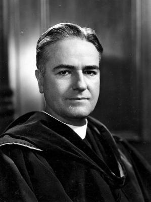 Black and white headshot of Fr. Lawrence C. Gorman in academic regalia