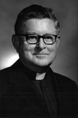 Black and white headshot of Fr. Robert J. Henle in clerical robes. 