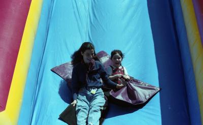 Students enjoying bouncy house on Georgetown Day, May 3, 2000