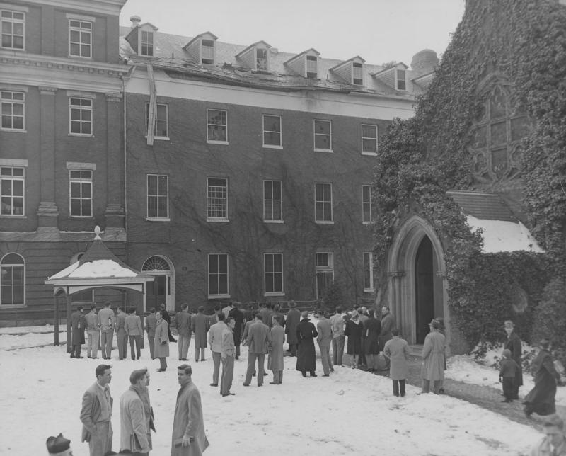 Students and faculty gathered to view fire damage to Isaac Hawkins Hall in 1947.