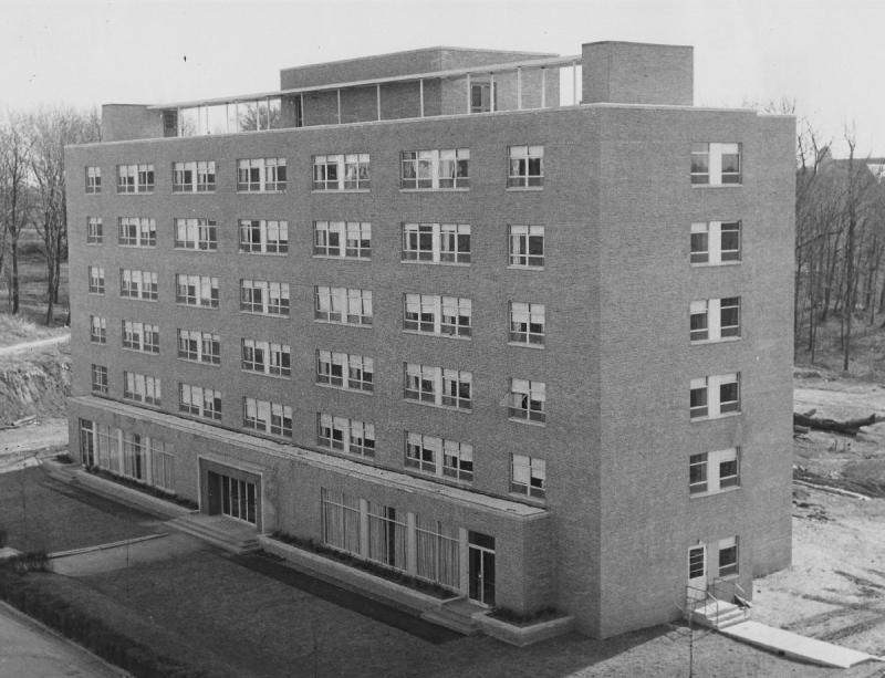 Black and white image of Kober-Cogan building in 1959 showing the building's brick facade and six stories.