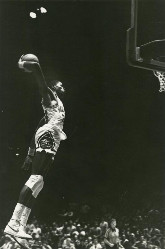 Ewing attempts a dunk from the side of the basket