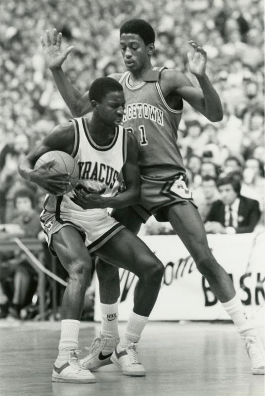 Floyd (21) guards a Syracuse player