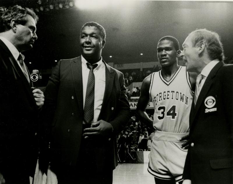 Williams and Coach Thompson are interviewed after a game against Kansas