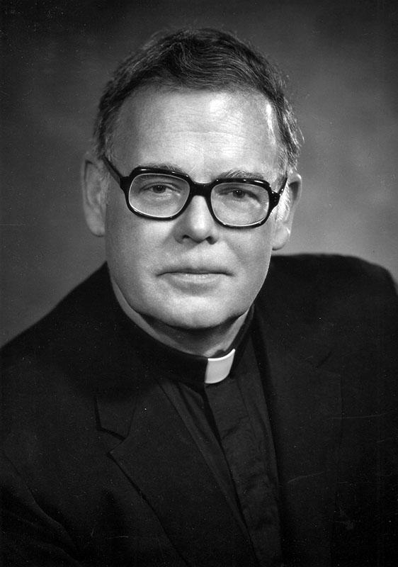 Black and white headshot of Fr. Timothy S. Healy, S.J. in clerical robes. 