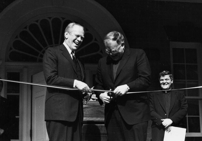 Former U.S. President Gerald Ford and Georgetown University President Timothy S. Healy, S.J., cut the ribbon at the rededication ceremony for the Old North Building