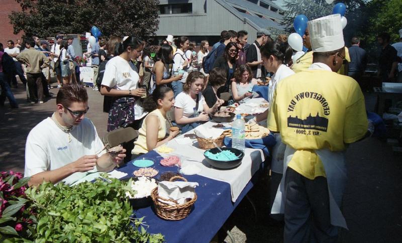 Students enjoying outdoor lunch on Georgetown Day. May 3, 2000